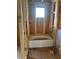 Unfinished bathroom features a bathtub and a small window for natural light at 166 Hammock Preserve Loop, Winter Garden, FL 34787