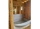 Unfinished bathroom shows a bathtub lined with a protective gray fabric at 166 Hammock Preserve Loop, Winter Garden, FL 34787