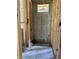 In-construction bathroom view showcasing the wooden frame, block walls and the start of plumbing and electrical systems at 166 Hammock Preserve Loop, Winter Garden, FL 34787