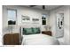Serene bedroom with modern decor, ambient lighting, and a view into the bathroom at 166 Hammock Preserve Loop, Winter Garden, FL 34787