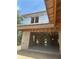 Unfinished exterior of house with open concept interior framing and cinder block walls at 166 Hammock Preserve Loop, Winter Garden, FL 34787