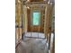 Hallway showcases the early stage of construction with wooden frames and electrical wiring exposed at 166 Hammock Preserve Loop, Winter Garden, FL 34787