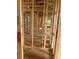 Framed hallway displays the skeletal structure of a modern home at 166 Hammock Preserve Loop, Winter Garden, FL 34787