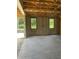 A bright in-construction space with open windows overlooking green outdoor foliage and cinderblock walls at 166 Hammock Preserve Loop, Winter Garden, FL 34787