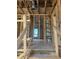 View of interior framing showing exposed ductwork, wooden beams and staircase at 166 Hammock Preserve Loop, Winter Garden, FL 34787