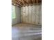 Bare in-construction room showcasing concrete flooring, cinderblock walls, and the start of plumbing and electrical systems at 166 Hammock Preserve Loop, Winter Garden, FL 34787