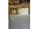 A bare in-construction living space featuring concrete flooring, cinderblock walls, and exposed beam ceiling at 166 Hammock Preserve Loop, Winter Garden, FL 34787