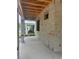 Outdoor patio area of the house under construction, featuring open-air design and block construction at 166 Hammock Preserve Loop, Winter Garden, FL 34787