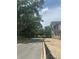Street view featuring mature trees and a serene, natural ambiance for a welcoming neighborhood at 166 Hammock Preserve Loop, Winter Garden, FL 34787