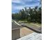 Street view featuring mature trees and a serene, natural ambiance for a welcoming neighborhood at 166 Hammock Preserve Loop, Winter Garden, FL 34787