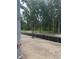 Street view featuring mature trees and a serene, natural ambiance for a welcoming neighborhood at 166 Hammock Preserve Loop, Winter Garden, FL 34787
