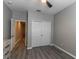 This bedroom offers wood-look floors, neutral paint, and closet space at 17437 Promenade Dr, Clermont, FL 34711