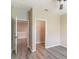 Bedroom with two closets including a walk-in closet, gray floors, and neutral paint at 17437 Promenade Dr, Clermont, FL 34711