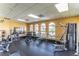 Well-equipped gym featuring modern exercise equipment, large windows, and ample space for workouts at 17437 Promenade Dr, Clermont, FL 34711