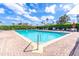 Community pool perfect for relaxation on a sunny day at 17437 Promenade Dr, Clermont, FL 34711