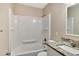 Bathroom featuring a granite vanity top and a shower over tub at 1810 Kingsland Ave, Orlando, FL 32808