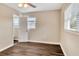 Bright bedroom featuring a ceiling fan, window, and modern hard surface flooring at 1810 Kingsland Ave, Orlando, FL 32808