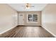 Inviting living room with wood-look flooring, ceiling fan, and natural light at 1810 Kingsland Ave, Orlando, FL 32808