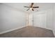 Bedroom with carpet, a ceiling fan, closet and entry way to bathroom at 200 Melissa Ct, Sanford, FL 32773