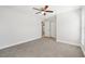 Bright bedroom featuring a ceiling fan and neutral carpet at 200 Melissa Ct, Sanford, FL 32773