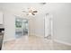 Bright and airy dining area features tile floors and glass sliding doors at 200 Melissa Ct, Sanford, FL 32773