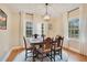 Charming dining room featuring an antique table and a light fixture, bathed in natural light at 201 W 16Th St, Sanford, FL 32771