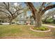 View of a charming single-Gathering home and mature tree at 201 W 16Th St, Sanford, FL 32771