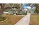 Inviting exterior view of a charming single-Gathering home with a detached garage and long driveway at 201 W 16Th St, Sanford, FL 32771