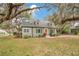 Charming single-Gathering home with a landscaped front yard and a pop of color on the front door at 201 W 16Th St, Sanford, FL 32771