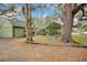 Home exterior featuring mature trees and a cozy seating area at 201 W 16Th St, Sanford, FL 32771