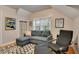 Cozy living room featuring a comfortable gray sofa, chair, and stylish rug at 201 W 16Th St, Sanford, FL 32771