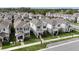 Serene neighborhood view of well-maintained two-story homes with neat landscaping and charming curb appeal at 210 Wooded Vine Dr, Winter Springs, FL 32708