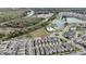 Aerial view of Primary-planned community with a community pool, playground, and nearby lakes at 210 Wooded Vine Dr, Winter Springs, FL 32708