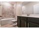 A well-lit bathroom features a tiled shower and a modern vanity, offering comfort and style at 210 Wooded Vine Dr, Winter Springs, FL 32708