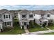 Well-maintained two-story home with neat landscaping, gray siding, and dark blue shutters, located in a friendly neighborhood at 210 Wooded Vine Dr, Winter Springs, FL 32708