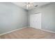 Bedroom featuring carpeted floors, a ceiling fan, and a closet with double doors at 2700 Child St, Ocoee, FL 34761