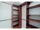 Walk-in closet with custom shelving and hanging rods for optimal storage at 2700 Child St, Ocoee, FL 34761