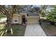 Charming single-story home with a two-car garage and mature landscaping at 2700 Child St, Ocoee, FL 34761