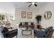 Cozy living room featuring wood floors, neutral walls, a ceiling fan, and modern decor at 2700 Child St, Ocoee, FL 34761