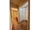 Hallway with a view to a bathroom and a walk-in closet with carpet flooring at 2952 Ashland S Ln, Kissimmee, FL 34741