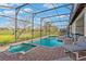 This screened in pool offers a jacuzzi and lounge area at 304 Summer Place Loop, Clermont, FL 34714