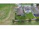 Aerial view of backyard with screened-in porch and solar panels on roof at 3136 Winesap Way, Winter Garden, FL 34787