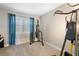 Carpeted bedroom with punching bag and home gym equipment at 3136 Winesap Way, Winter Garden, FL 34787