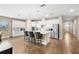 Bright, modern kitchen with white cabinetry, stainless steel appliances, and a center island with seating at 3136 Winesap Way, Winter Garden, FL 34787