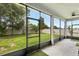 Screened patio with green grass and a view of the fenced backyard at 3136 Winesap Way, Winter Garden, FL 34787