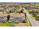 Aerial view of home with screened in patios and pools in a peaceful residential neighborhood at 3197 Pequod Pl, Kissimmee, FL 34746