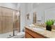 Cozy bathroom with a walk-in shower, granite vanity, and modern fixtures at 3197 Pequod Pl, Kissimmee, FL 34746