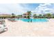 Large community pool with cabana, seating and a water activity for the to enjoy at 3197 Pequod Pl, Kissimmee, FL 34746