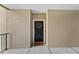 Inviting front entrance featuring a black door with a wreath and a 'Gather' doormat at 3406 Soho St # 201, Orlando, FL 32835