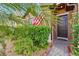 Close up of the home's front door and surrounding well maintained landscape at 3430 Halsway Dr, Orlando, FL 32824